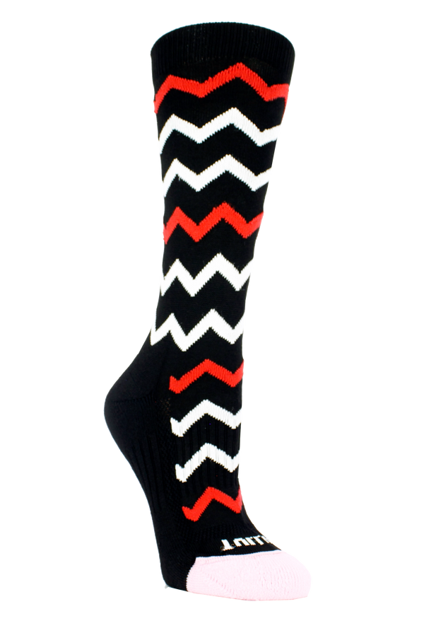 black sock with zig zag patterns in red white and pink. Toe is cushioned with pink yarn. Non-binding footbed is black with Tulliani written in pink on top of foot
